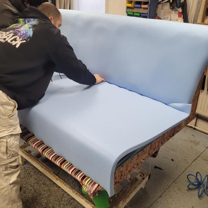 Sofa stripped back to new foam during reupholstery at Crown Upholstery, Wallasey