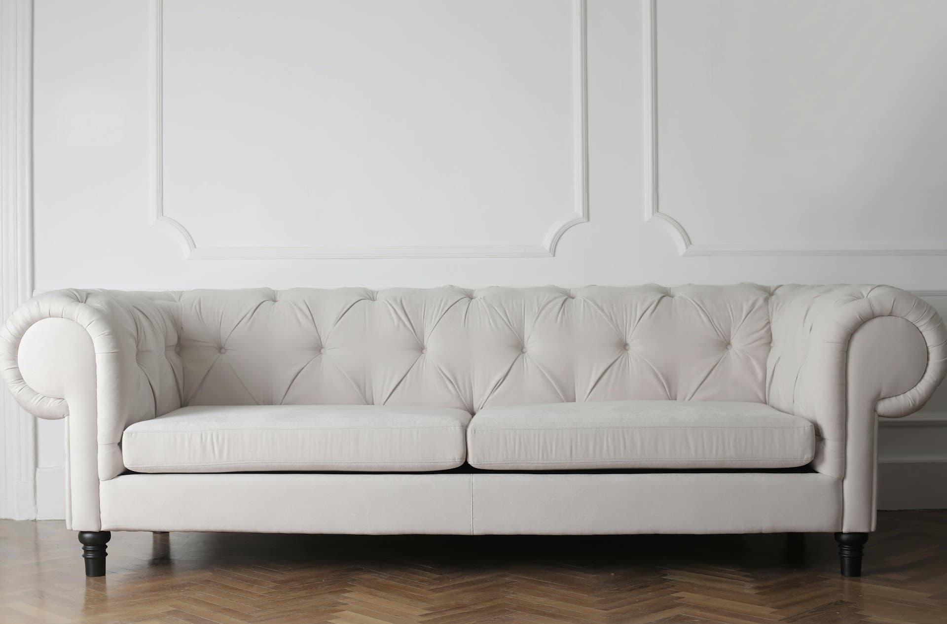 White buttoned chesterfield sofa upholstered by Crown Upholstery, Wallasey